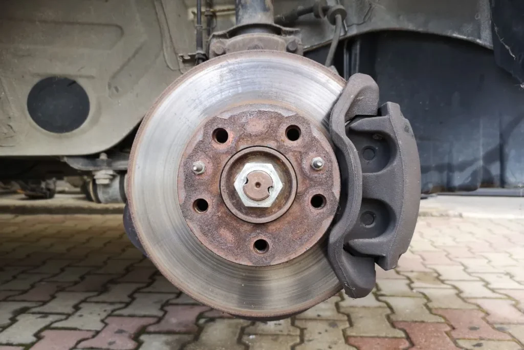 Worn brake disc and hub assembly exposed during rear main seal leak diagnosis and repair